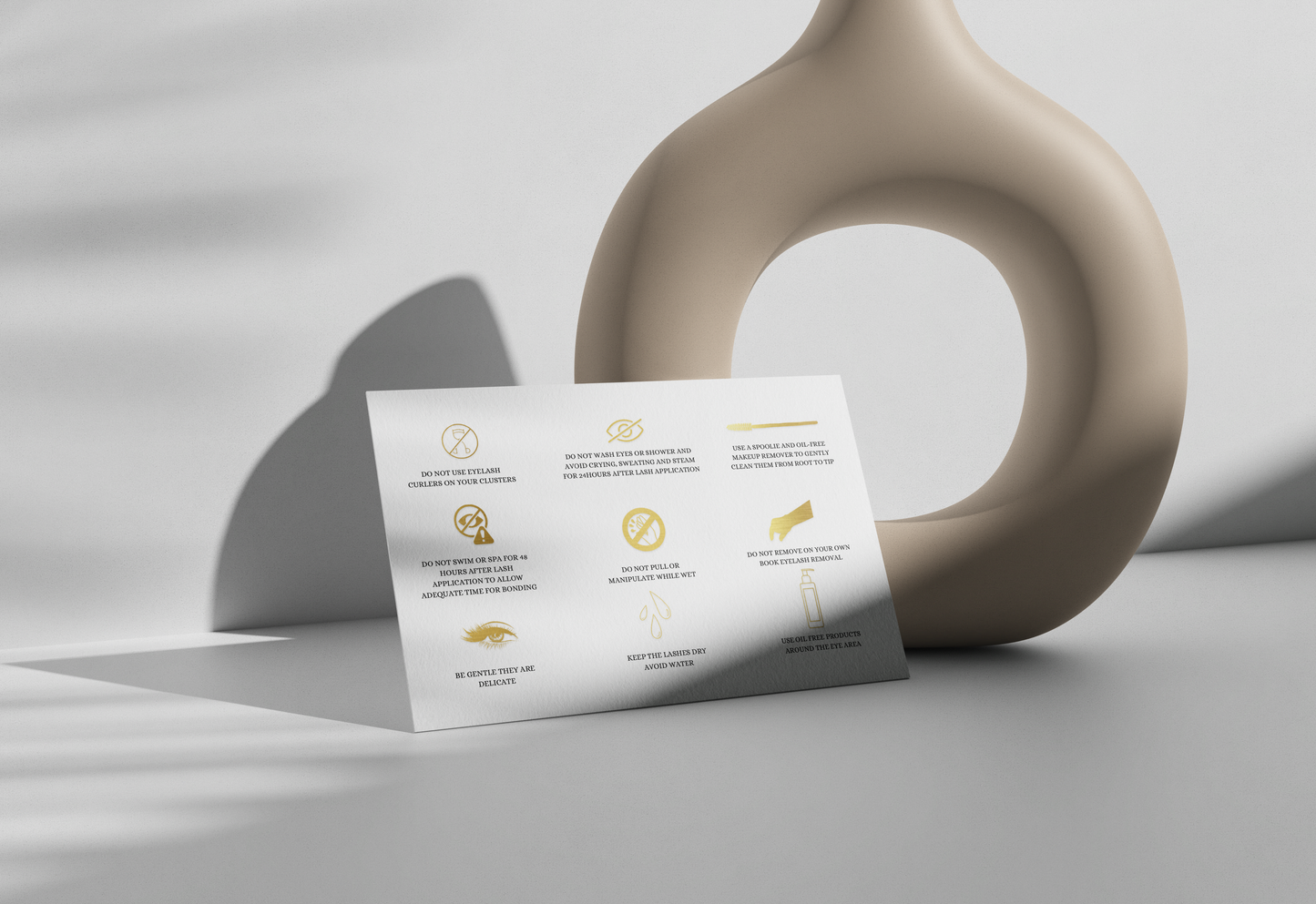 Allure Eyelash cluster aftercare cards with gold icons and care instructions on white card