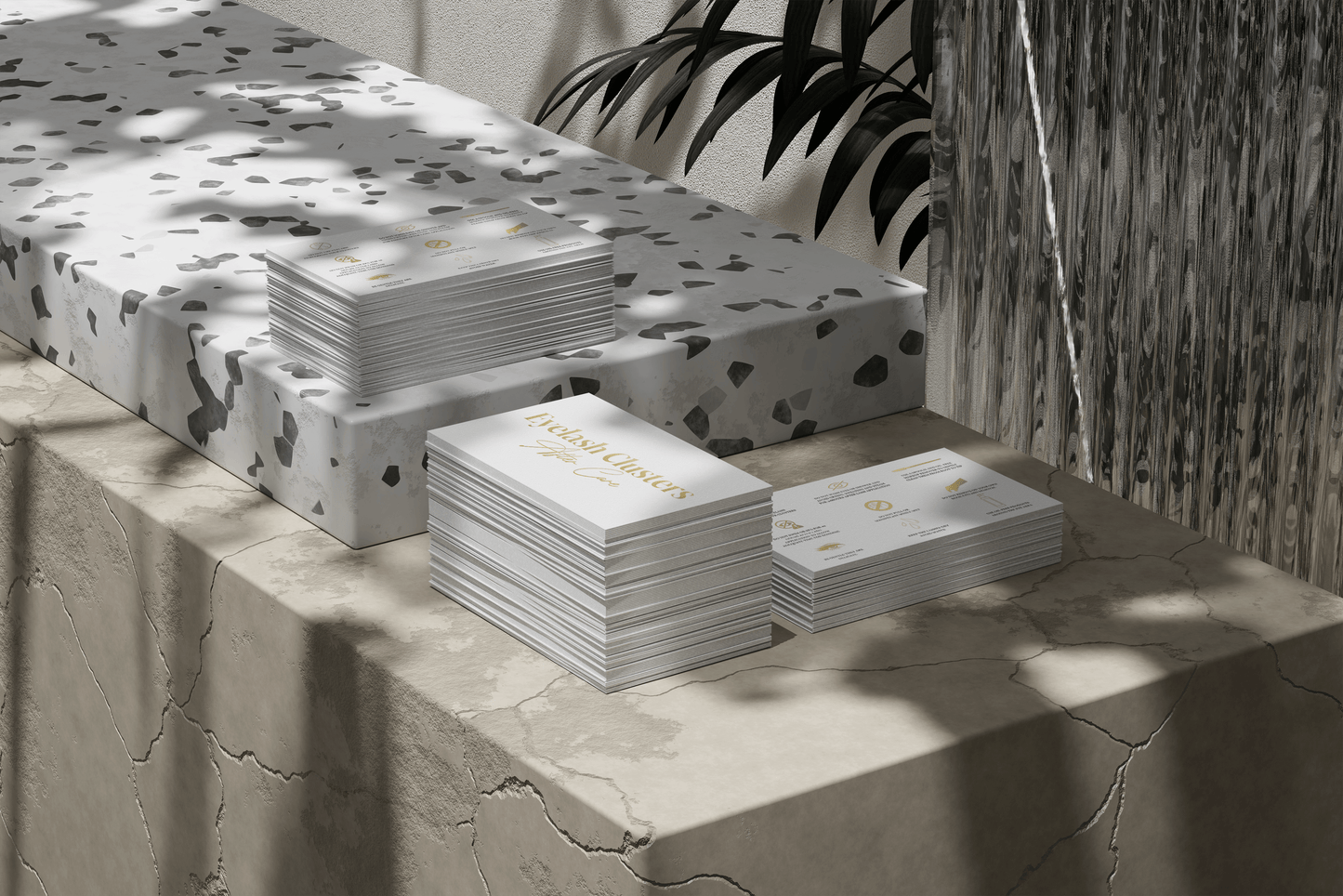 Allure Eyelash stacked eyelash cluster aftercare cards on decorative marble and patterned surfaces