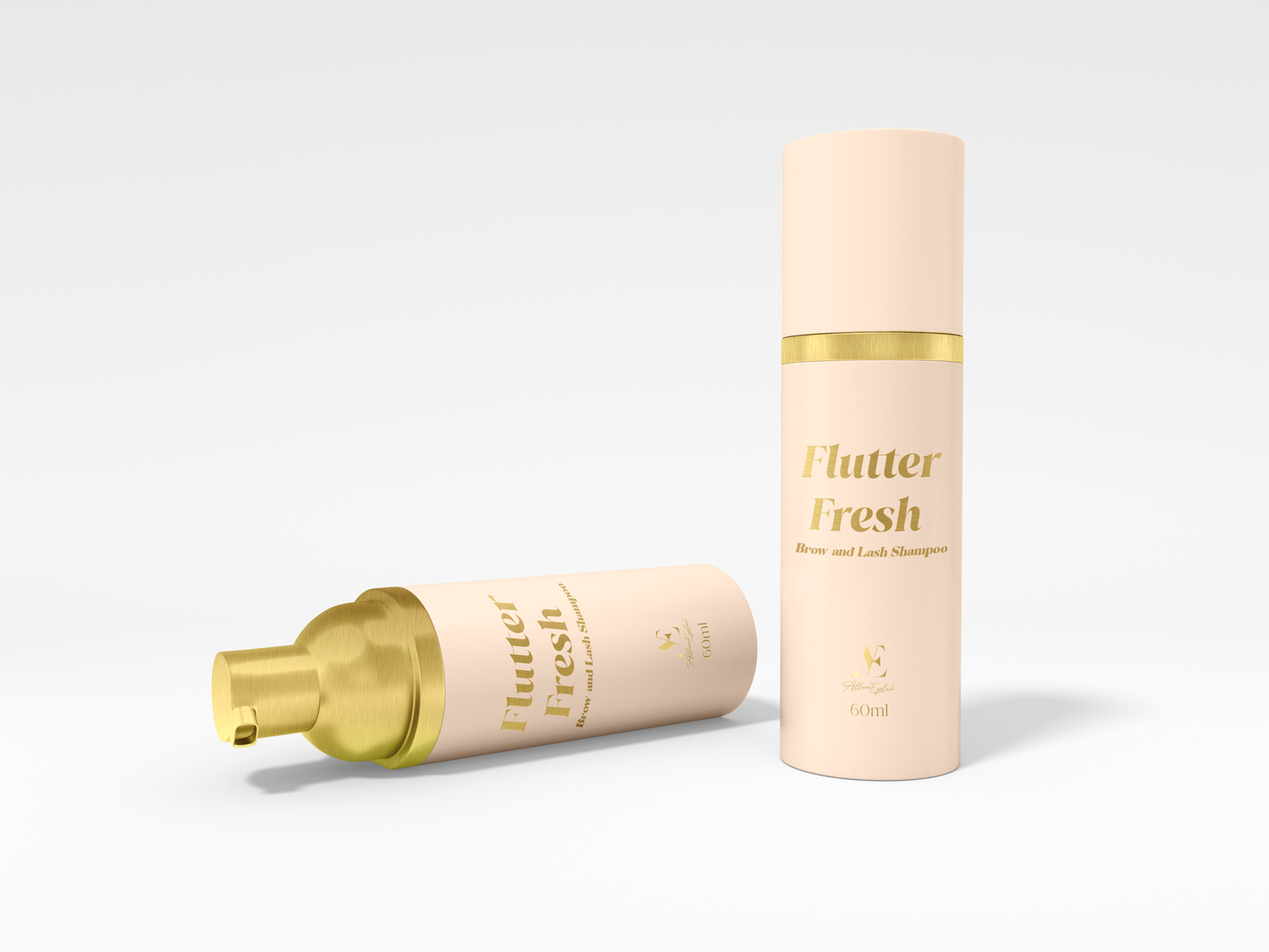 Flutter Fresh brow and lash shampoo bottles with gold and peach packaging for gentle lash care