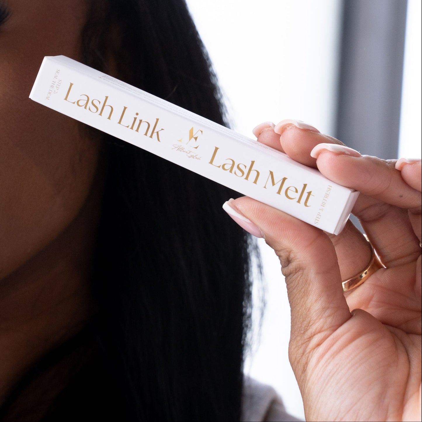 My Store Lash Link Lash Melt salon quality lash sealant package held near face