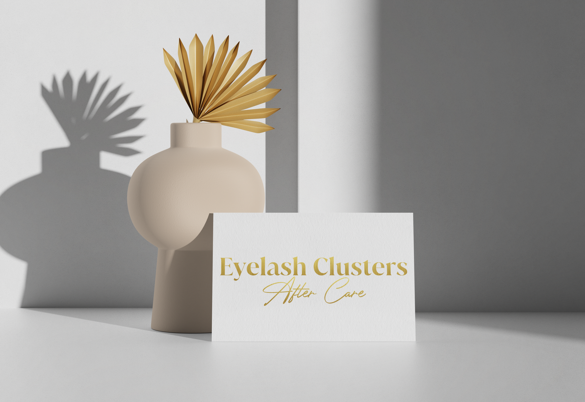 Allure Eyelash cluster aftercare cards with gold text displayed next to beige decorative vase